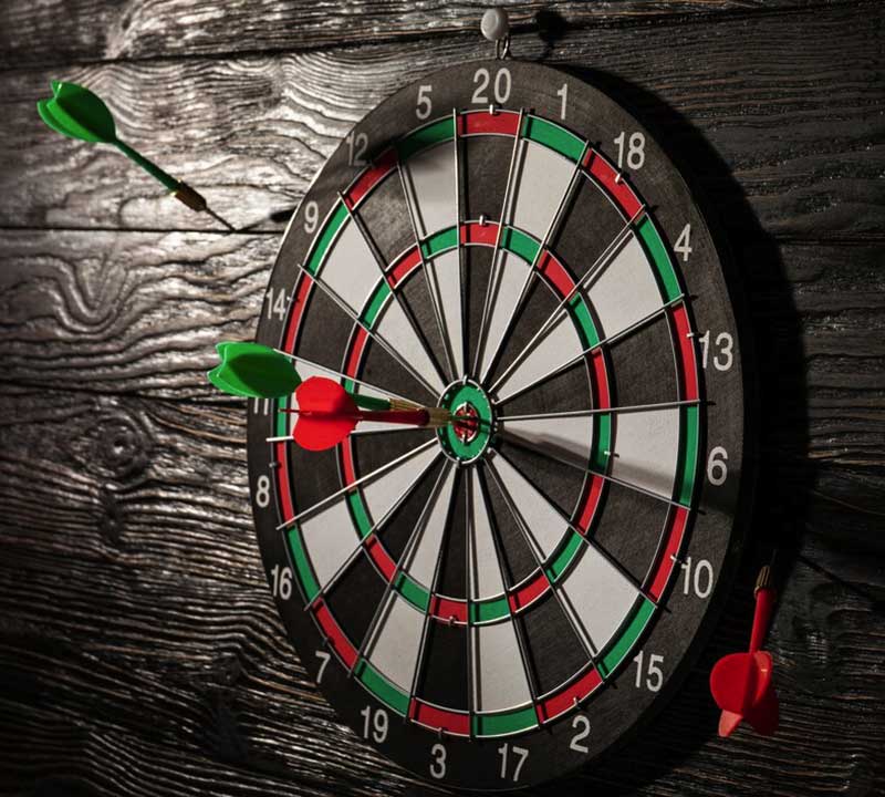 A wall-mounted darts board, representing the darts medal category.